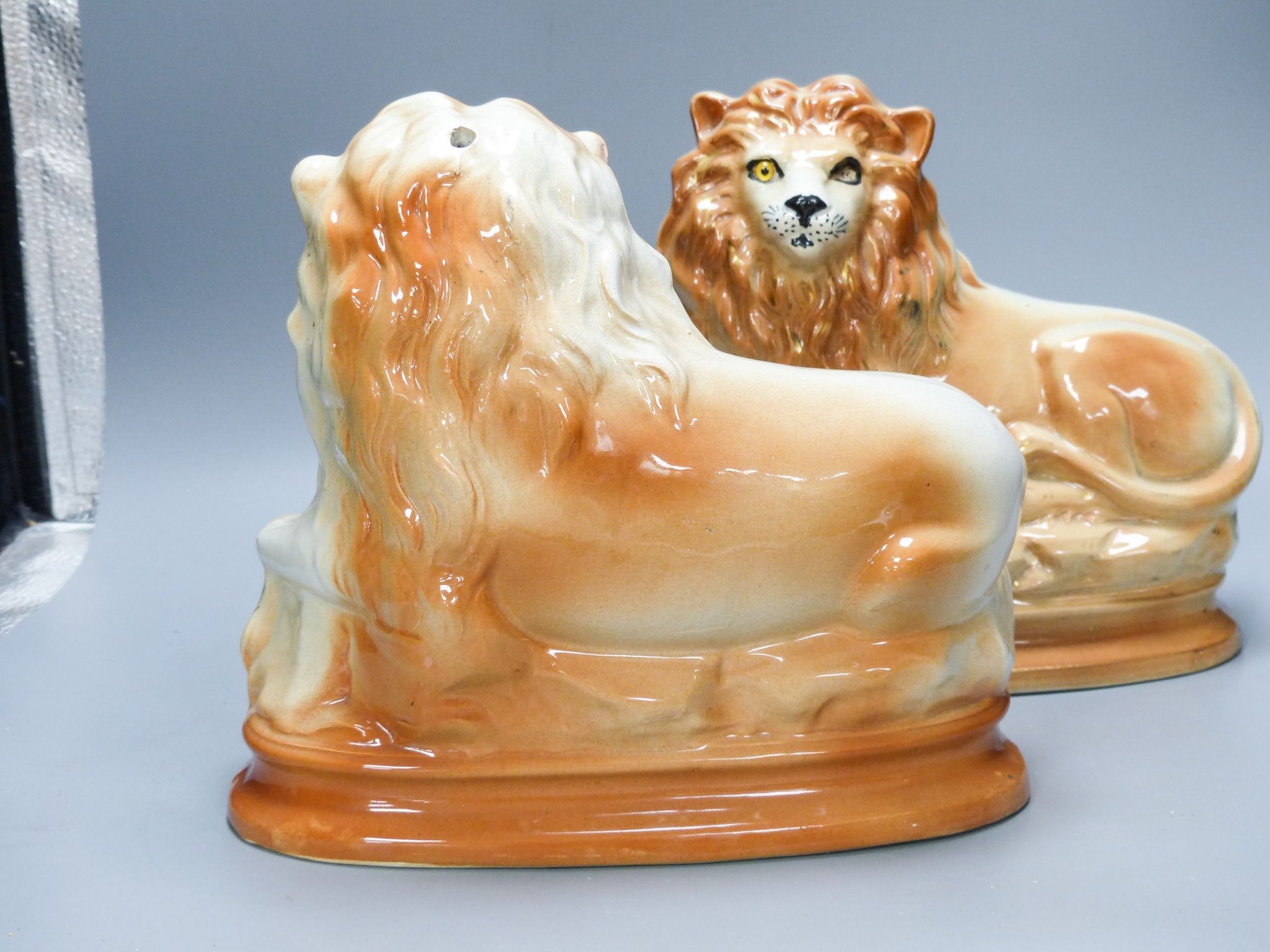 A pair of Staffordshire pottery 'lion' figures 30cm